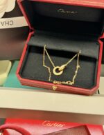 CARTIER PENDENTIF LOVE PAVÉ OR ROSE SERTI DE 48 DIAMANTS 38 ET 41 CM