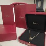 CARTIER PENDENTIF LOVE OR JAUNE 750/1000, 2 DIAMANTS
